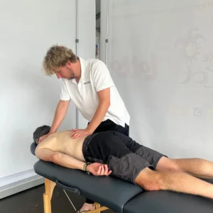 Mensa Pratijk physiotherapist giving a sailor a back massage at the SB20 European Championship 2025 in Ostend