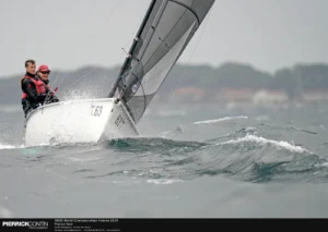 SB20 crew hiking hard upwind through waves at Hyères
