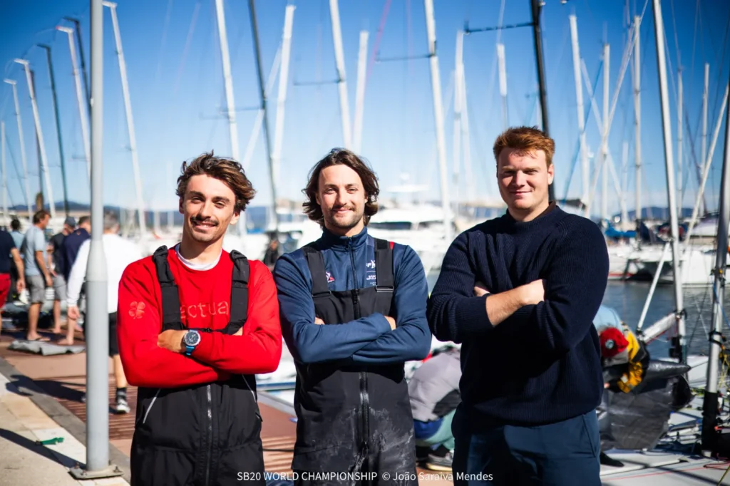 Three sailors on the pontoon in Hyères on Day 3 of the SB20 World Championship
