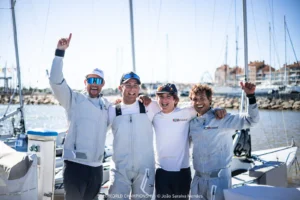 Crew celebrating on the dock in Hyères on Day 3 of the SB20 World Championship