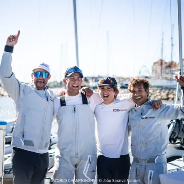 Crew celebrating on the dock in Hyères on Day 3 of the SB20 World Championship