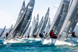 SB20 fleet racing close together upwind in Hyères