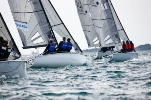 SB20 fleet sailing upwind in a strong Mistral